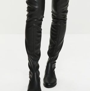 Black lather over the knee boots.
